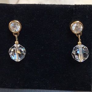 Crystal ball hanging from a bezel set CZ stone, pierced earrings
